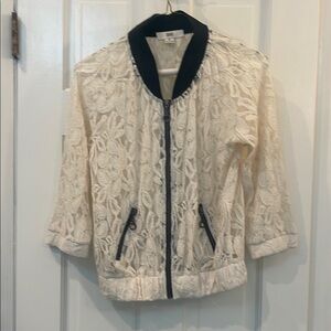 Brand new lacy S zip up jacket never worn elastic around wrists and bottom